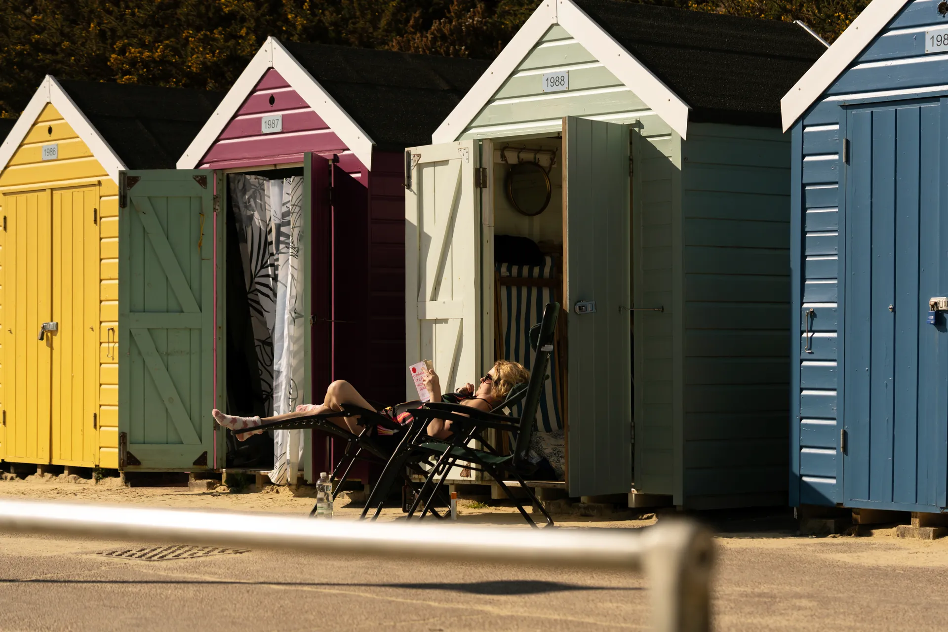 Colourful beach huts along Alum Chine