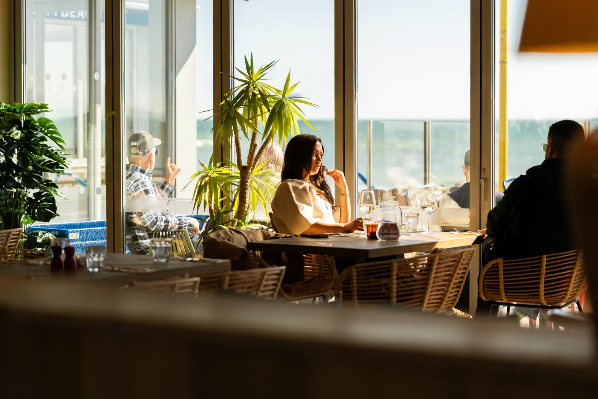 Guests dining with a view of the sea