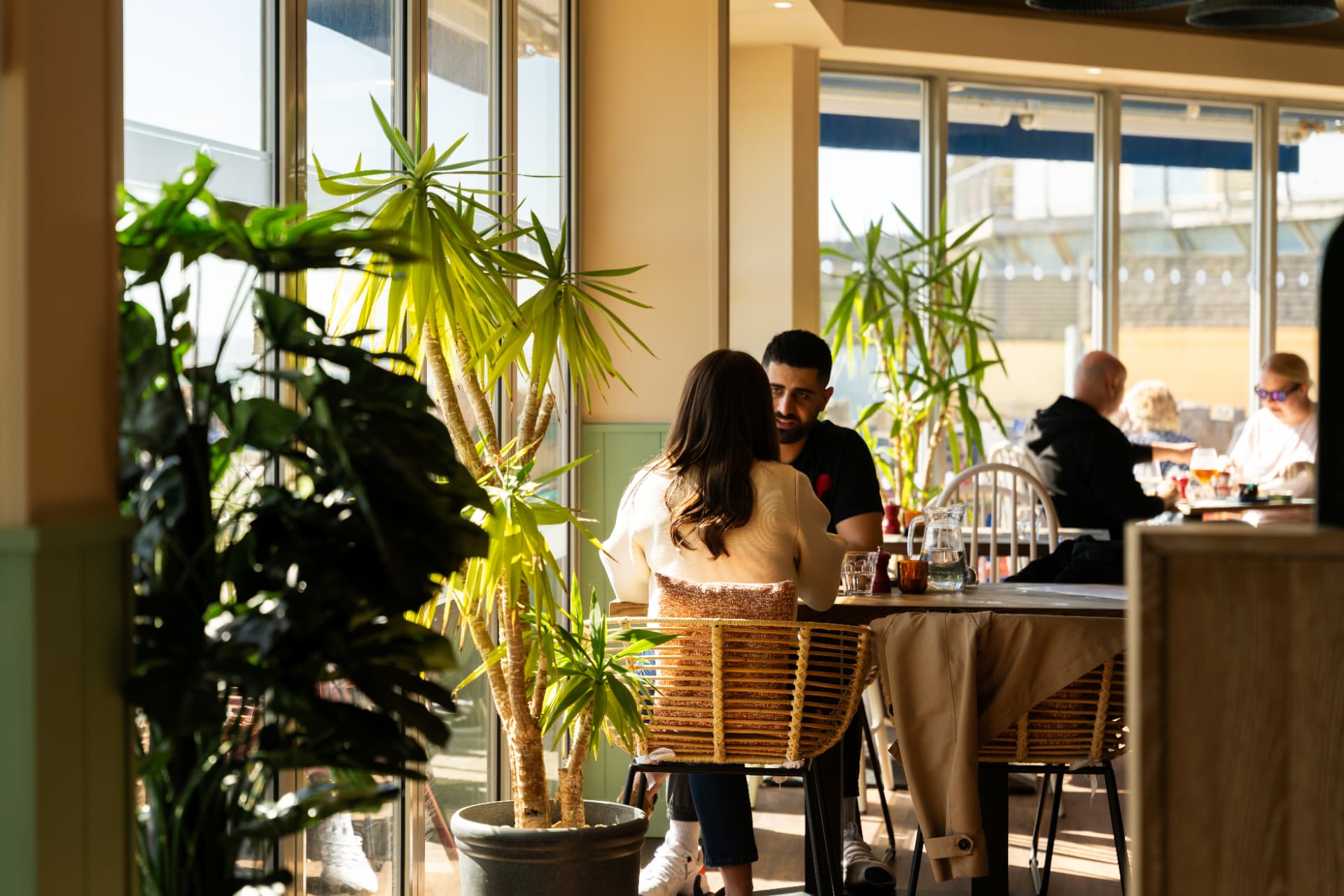 Guests dining at Alum Beach Hut