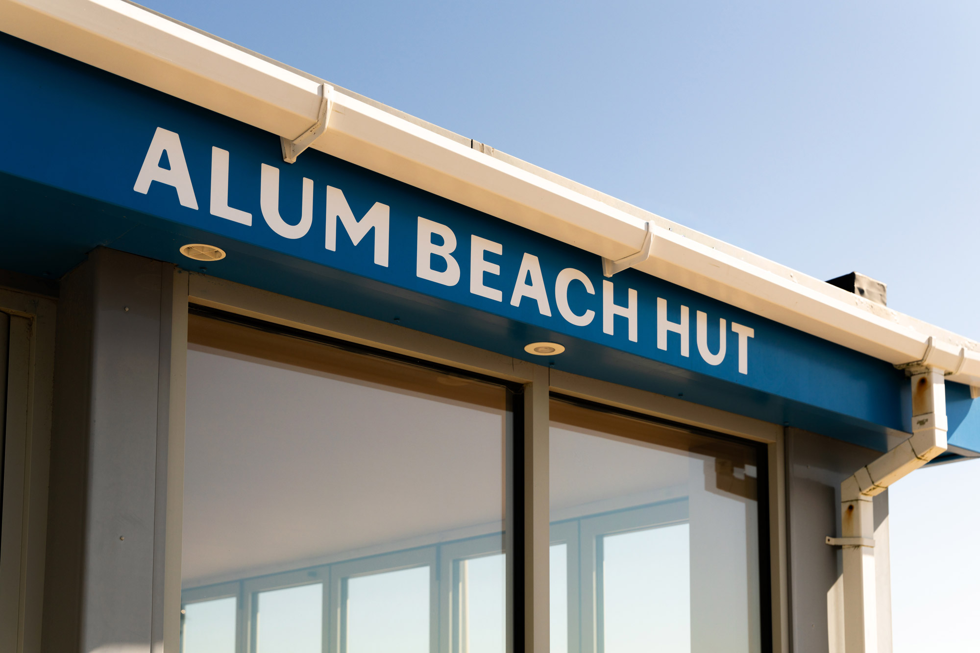 Alum Beach Hut signage