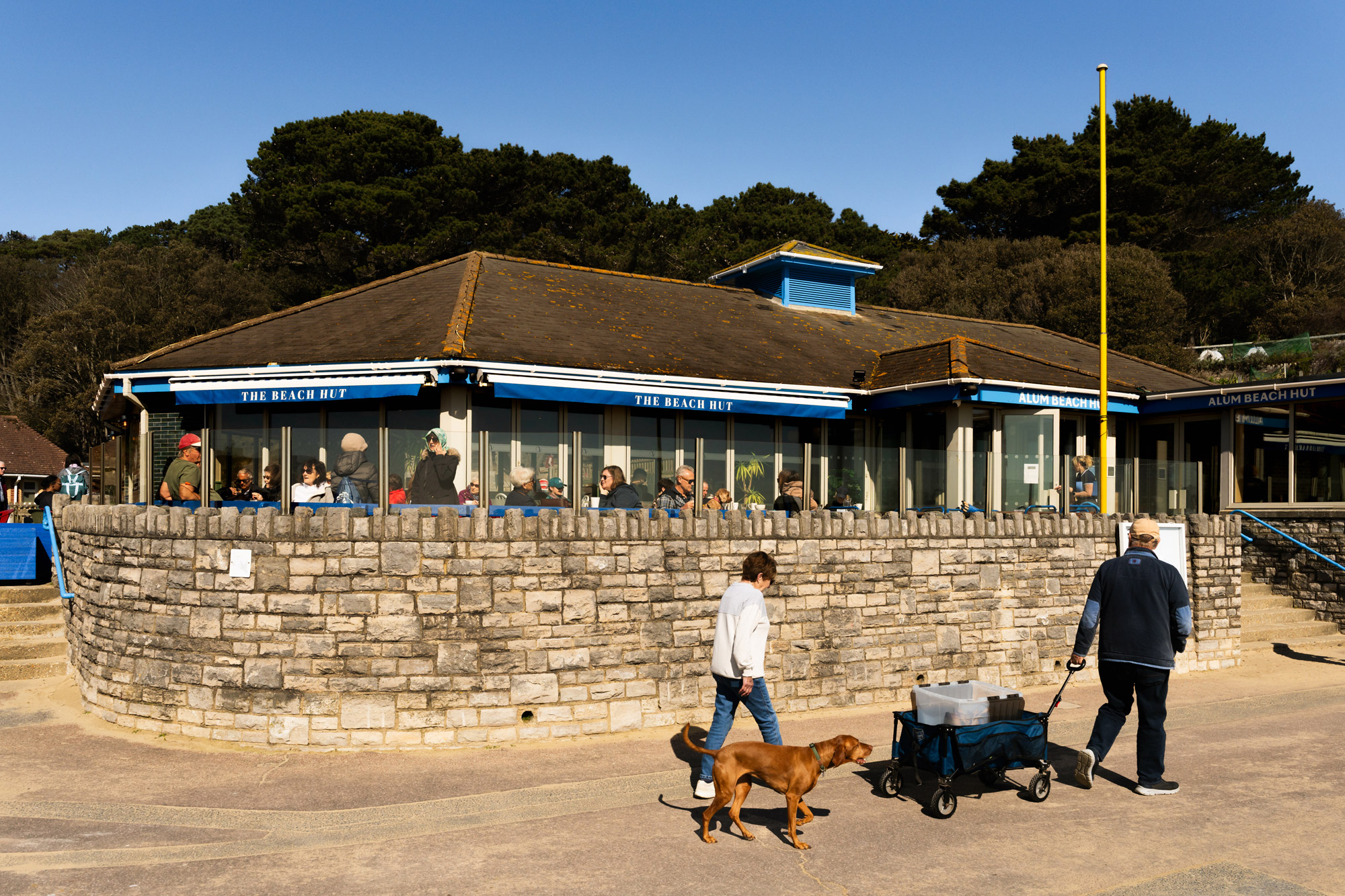Alum Beach Hut exterior with stone wall